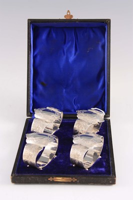 Lot 341 - A SET OF FOUR ENGRAVED SILVER NAPKIN RINGS of...