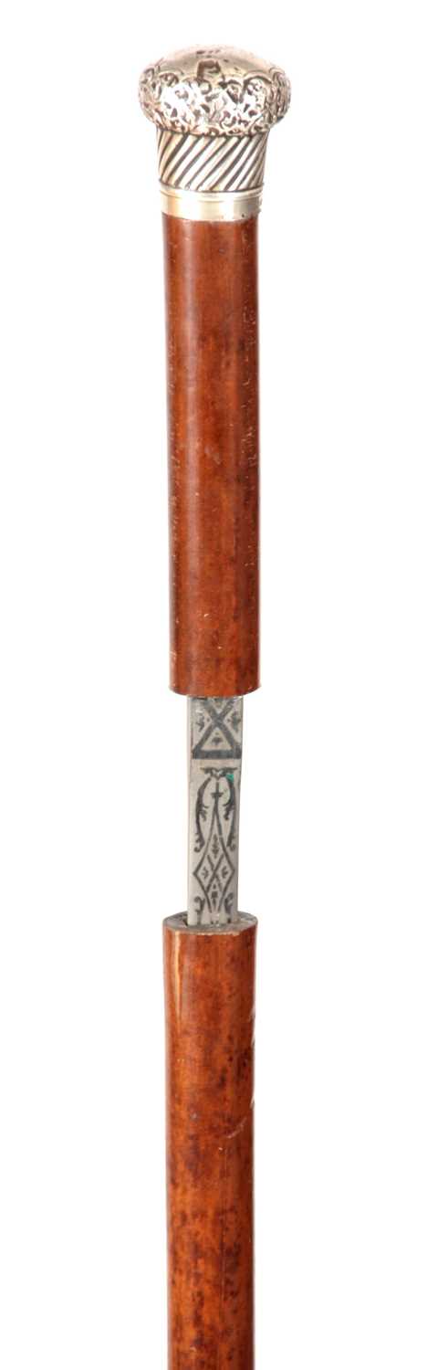 Lot 434 - A 19TH CENTURY MALACCA SWORD STICK with...