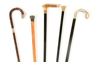 Lot 441 - A COLLECTION OF FIVE WALKING CANES a horn and...