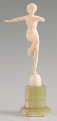 Lot 541 - AN ART DECO CARVED IVORY FIGURE modelled as a...