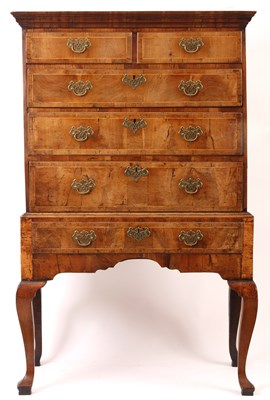 Lot 868 - AN EARLY 18th CENTURY FIGURED WALNUT CHEST ON...