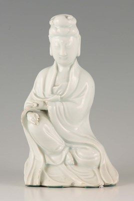 Lot 63 - A CHINESE BLANC DE CHINE FIGURE OF A SEATED...