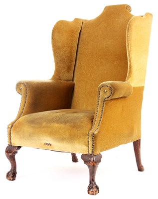 Lot 965 - A GOERGE I STYLE UPHOLSTERED WINGBACK ARMCHAIR...