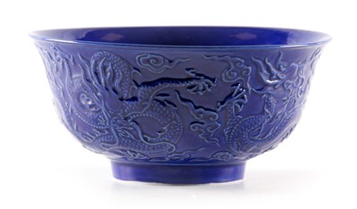 Lot 75 - A CHINESE BLUE GLAZED BOWL having relief work...