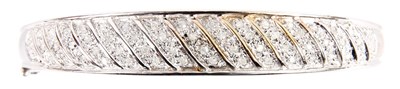 Lot 227 - A 9CT WHITE GOLD HALF HINGED BANGLE of double...