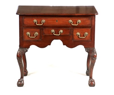 Lot 935 - A GEORGE III MAHOGANY LOWBOY with moulded top...