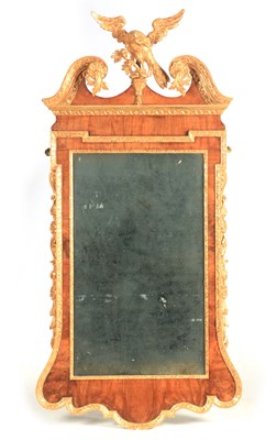 Lot 938 - A GEORGE II WALNUT AND PARCEL-GILT MIRROR the...