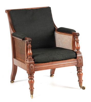 Lot 1000 - A REGENCY MAHOGANY BERGERE LIBRARY CHAIR OF...