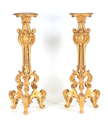 Lot 1077 - A PAIR OF GILT GESSO TORCHERES of rococo...