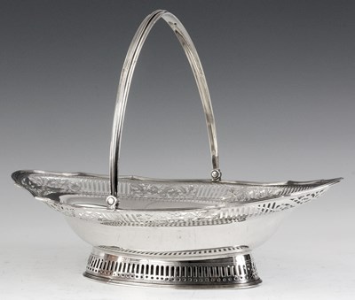 Lot 297 - A GEORGE III LARGE SILVER FRUIT BASKET of oval...