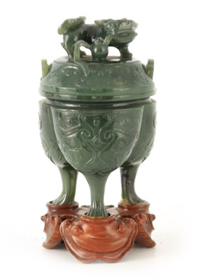 Lot 198 - A CHINESE SPINAGE GREEN JADE KORO AND COVER of...