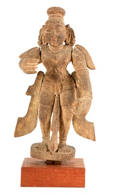 Lot 223 - AN EARLY TIBETAN CARVED WOOD FIGURE OF A...