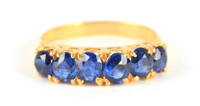 Lot 247 - A LADIES SIX STONE BURMESE SAPPHIRE RING...