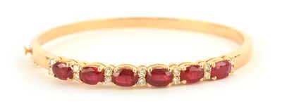 Lot 261 - AN 18CT YELLOW GOLD RUBY AND DIAMOND HINGED...