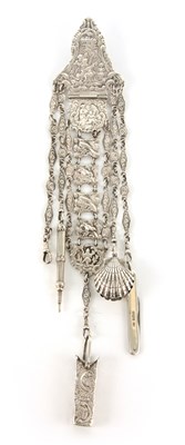 Lot 327 - A VICTORIAN SILVER CHATELAINE with embossed...