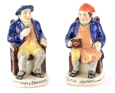 Lot 39 - A PAIR OF COLOURFUL SEATED STAFFORDSHIRE TOBY...