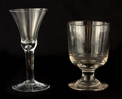 Lot 4 - A GEORGIAN PLAIN CLEAR WINE GLASS with flared...