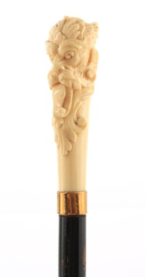 Lot 420 - A LATE 19TH CENTURY IVORY CARVED HEAD WALKING...