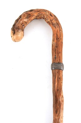 Lot 428 - A CONTINENTAL KNARLED ROOT WOOD WALKING STICK...