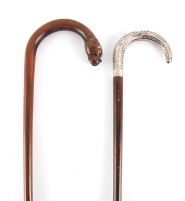 Lot 443 - TWO 19TH CENTURY MAHOGANY WALKING STICKS one...