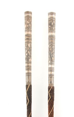 Lot 444 - TWO 19TH CENTURY EASTERN CAMEL WHIPS WITH PULL...