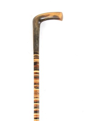 Lot 464 - A SECTIONAL HORN WALKING STICK WITH RHINO HORN...