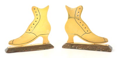 Lot 477 - A PAIR OF 19TH CENTURY BRASS BOOTS on...