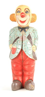 Lot 533 - A CARVED PAINTED WOOD SCULPTURE OF A CLOWN...