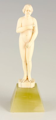 Lot 598 - AN ART DECO SMALL IVORY STANDING NUDE FIGURE...