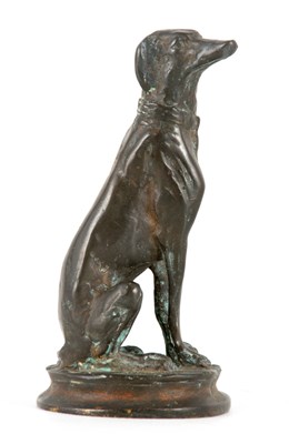 Lot 611 - A CAST BRONZE SEATED FIGURE OF A DOG after...