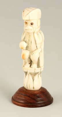 Lot 658 - AN EARLY CARVED IVORY FIGURE