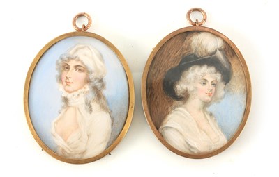 Lot 697 - A PAIR OF 19TH CENTURY OVAL PORTRAITS ON IVORY...