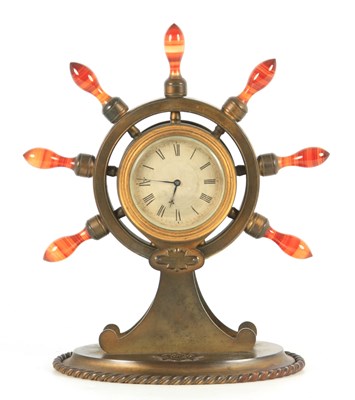 Lot 809 - A 19TH CENTURY GILT BRASS SHIP'S WHEEL CLOCK...