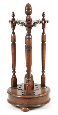 Lot 942 - A LATE 19TH/ EARLY 20TH CENTURY REVOLVING OAK...