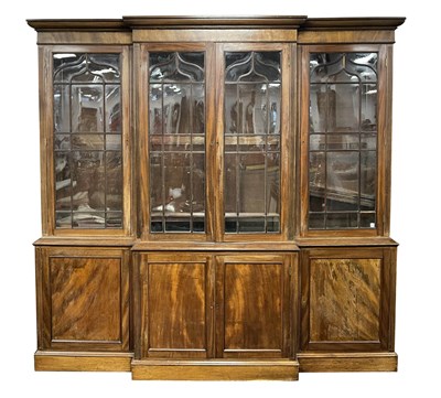 Lot 985 - A 19TH CENTURY MAHOGANY BREAKFRONT LIBRARY...