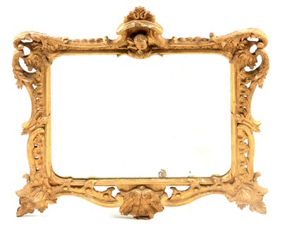 Lot 988 - AN 18TH CENTURY CARVED GILTWOOD HANGING MIRROR...