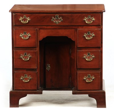 Lot 994 - A MID 18TH CENTURY MAHOGANY KNEEHOLE DESK with...