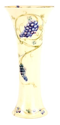 Lot 108 - AN EARLY WILLIAM MOORCROFT TALL TAPERING...