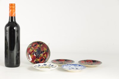 Lot 122 - A COLLECTION OF FIVE MOORCROFT SAUCERS...