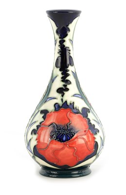 Lot 183 - A WILLIAM MOORCROFT FOOTED BULBOUS VASE WITH...