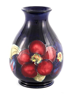 Lot 270 - A WALTER MOORCROFT SMALL BULBOUS FOOTED VASE...