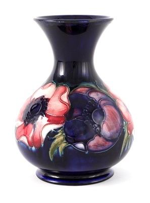 Lot 275 - A WALTER MOORCROFT FOOTED BULBOUS VASE WITH...