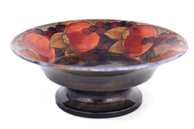 Lot 34 - A 1920S WILLIAM MOORCROFT FOOTED FRUIT BOWL...