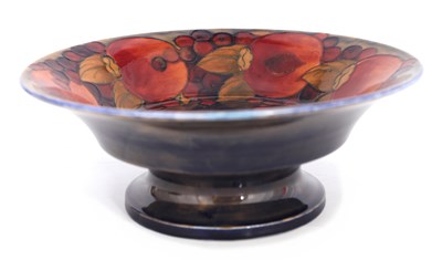Lot 34 - A 1920S WILLIAM MOORCROFT FOOTED FRUIT BOWL...