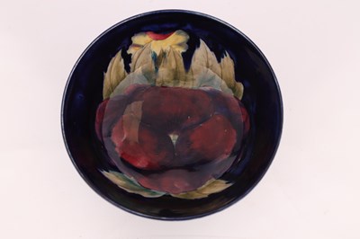 Lot 35 - A MOORCROFT BURSLEM FOOTED BOWL decorated in...