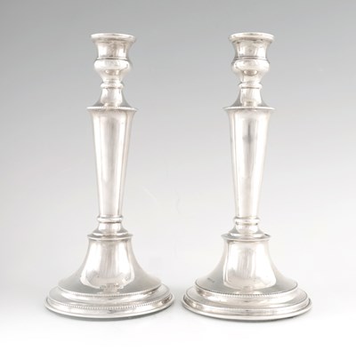 Lot 375 - A PAIR OF MID 20TH CENTURY SILVER CANDLESTICKS...