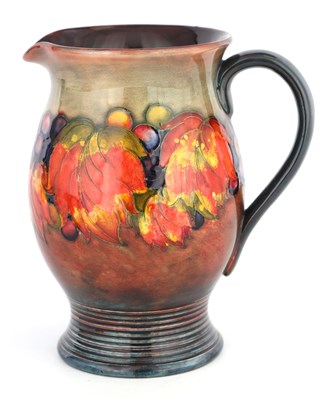 Lot 41 - A 1930S MOORCROFT OVOID JUG WITH RIBBED FOOT...