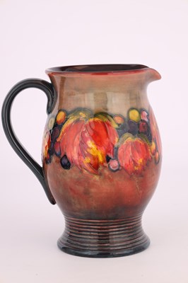 Lot 41 - A 1930S MOORCROFT OVOID JUG WITH RIBBED FOOT...