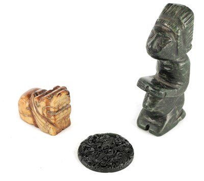 Lot 427 - A CHINESE RUSETT JADE CARVING OF A FOO DOG 5cm...