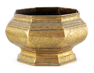 Lot 453 - AN EARLY ISLAMIC BRASS OCTAGONAL JARDINIERE...